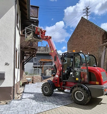 Radlader mit Teleskoparm